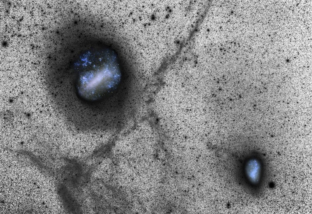 Each of the thousands of spots in this new image represents a distant star, and the glittering blue holes reveal glimpses of our neighbouring galaxies, the Large and Small Magellanic Clouds. Although this image looks as if it was made on a large scale telescope it was in fact captured from ESO’s La Silla Observatory using a portable setup consisting of a SBIG STL-11000M CCD camera and a Canon prime lens. It was presented in a scientific paper alongside state-of-the art simulations, in an exciting example of how a small camera, a fast lens, a long exposure time and one of the world’s best astronomical sites can reveal huge faint features better than even a big telescope. This deep image was captured using the LRGB method, and provides an insight into the actual process of creating spectacular astrophotography. Many challenges face those attempting to photograph the night sky, including interference from light sources other than the object being photographed, and capturing objects in sufficient depth. Trying to maximise the signal received from the target, whilst minimising input from other sources — known as noise — is a crucial aspect of astrophotography. The optimisation of the signal to noise ratio is far more easily achieved in black-and-white than in colour. Therefore a clever trick often employed to capture a high-quality image is the use of a luminance exposure, which produces richly detailed monochrome images like the one seen here. Colour details from images taken through colour filters can then be overlaid or inset, as the Magellanic Clouds have been here. Link: Science Paper